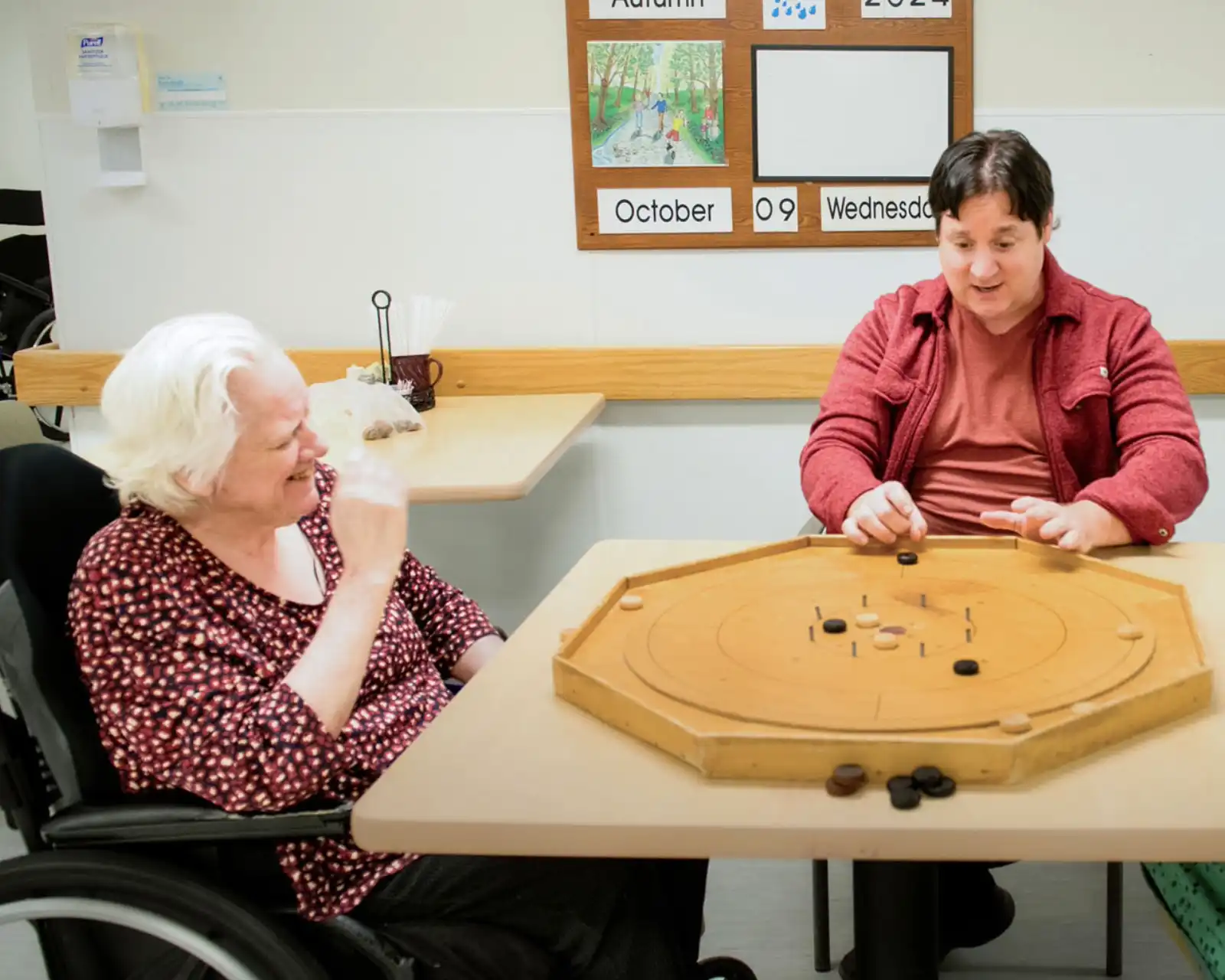 GPL residents play board game with volunteer