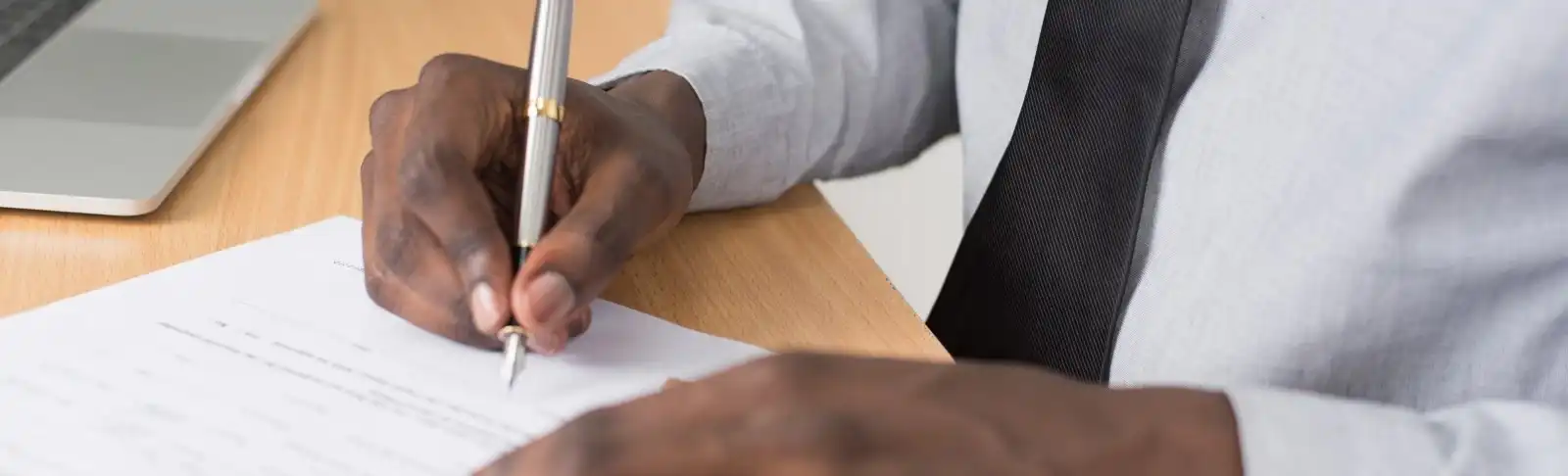 Person signs document