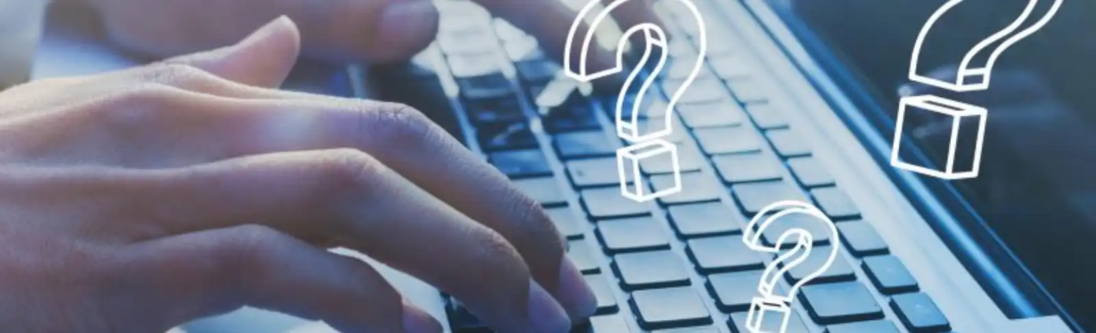 hand typing on the keyboard of a laptop.