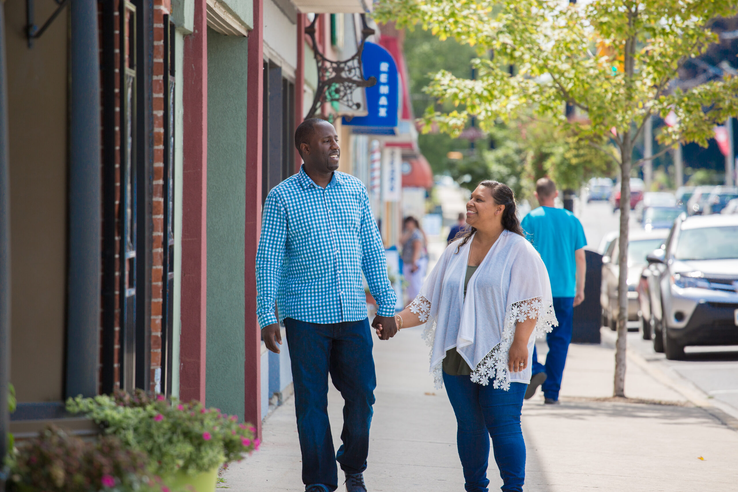 Couple walking downtown while shopping