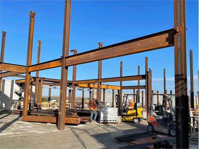 Facility under construction with metal supportive beams.