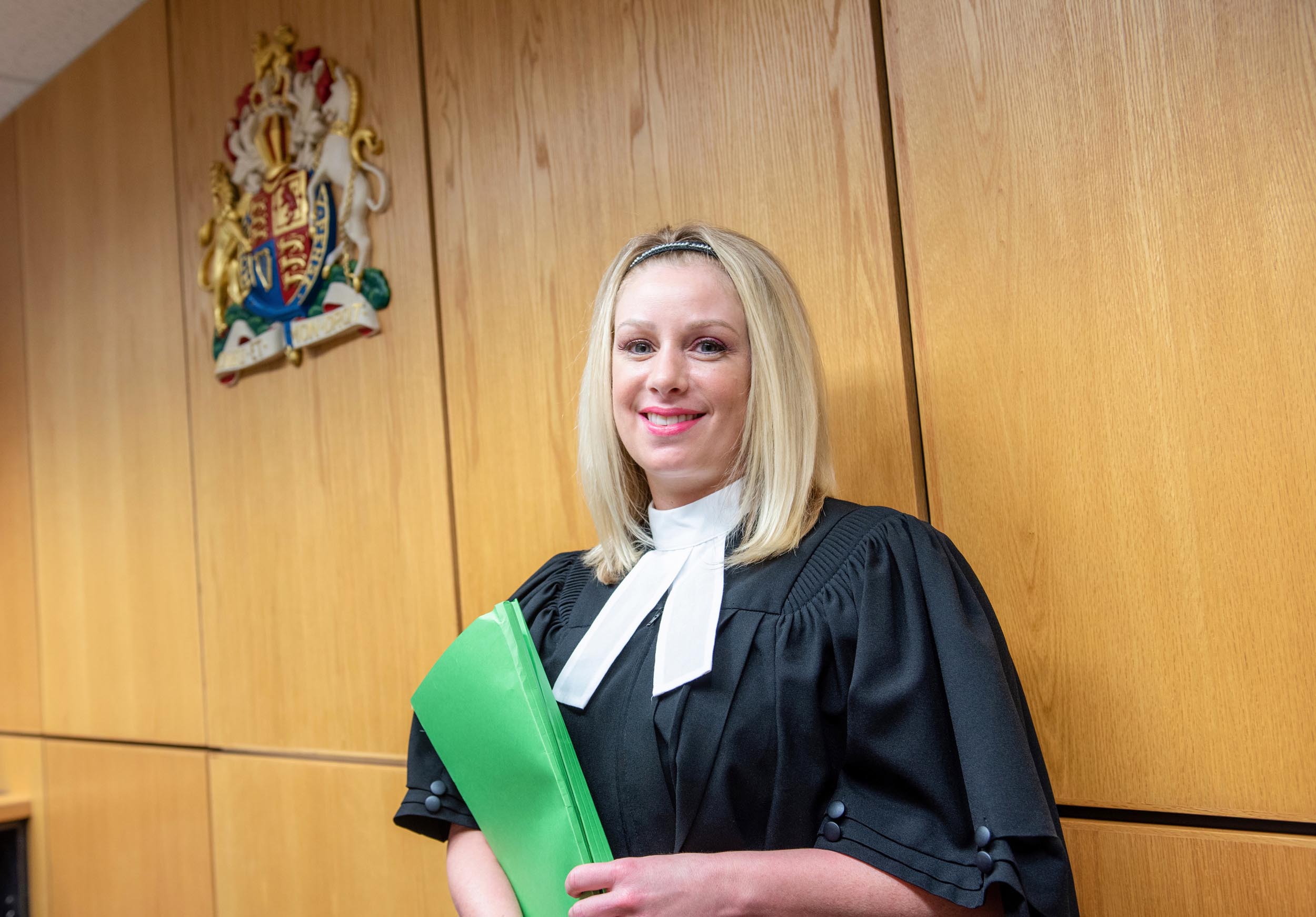 Court Services staff wears robe in courtroom