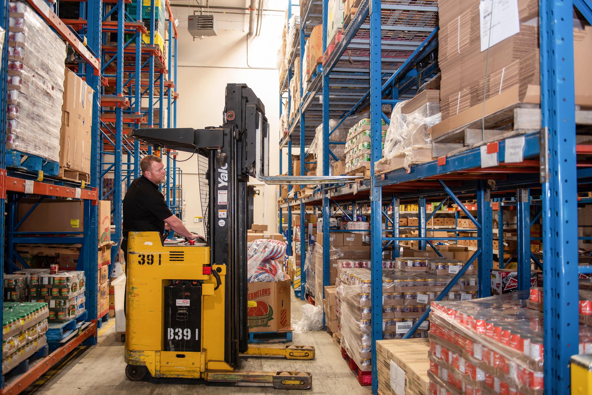 Food 4 All staff uses forklift