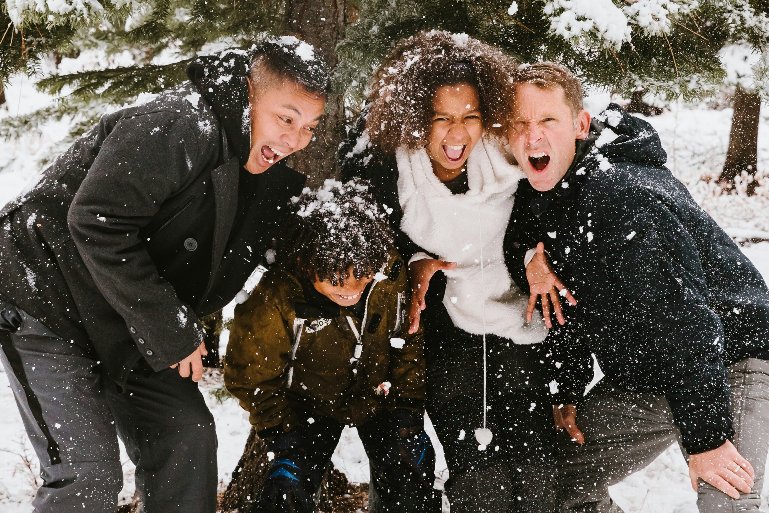 Family playing in the snow.
