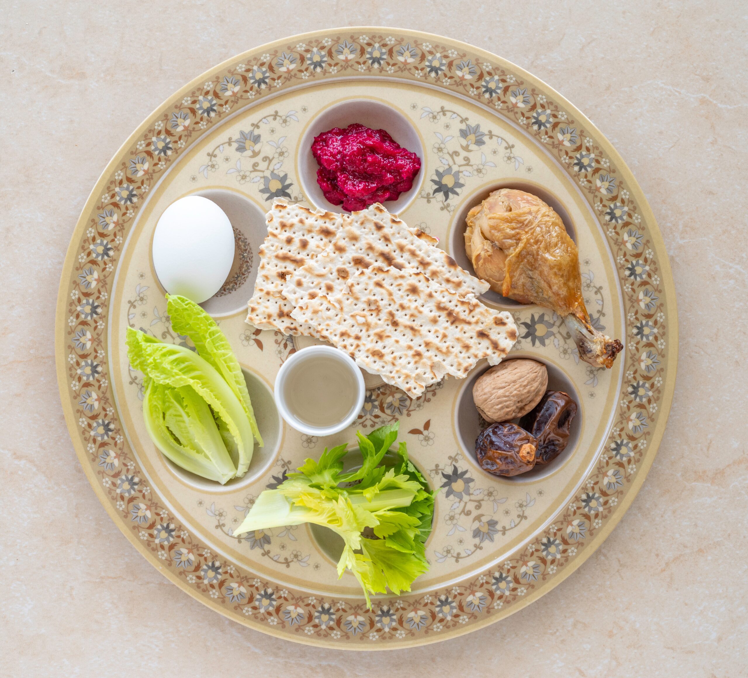 Traditional Passover foods displayed on a plate.